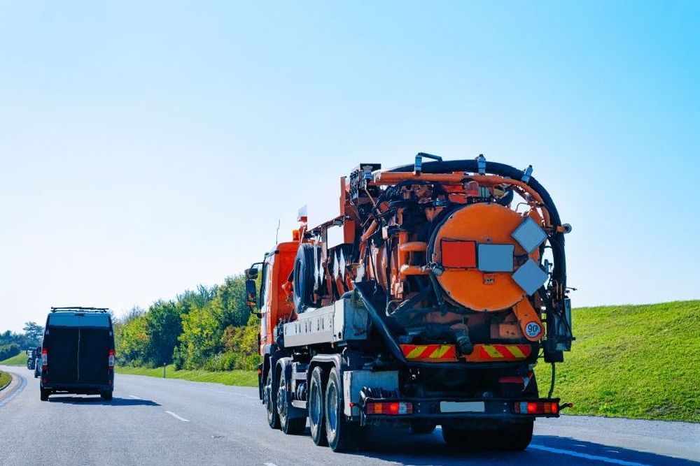 A Hose is Attached to the Back of a Truck — Sue's Clear Water in Sarina, QLD 