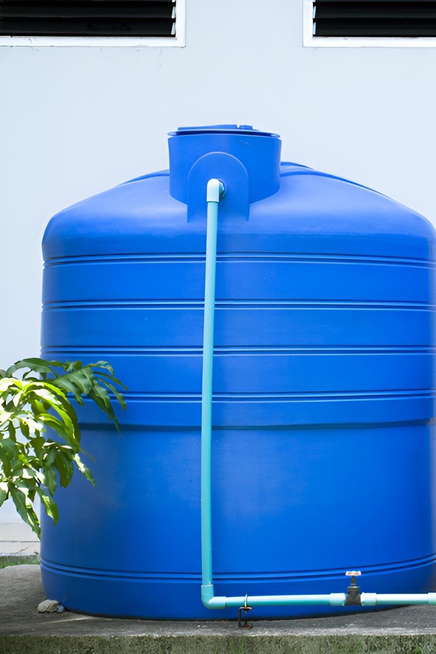 Two Blue Water Tanks Are Sitting Next to Each Other — Sue's Clear Water in Seaforth, QLD 