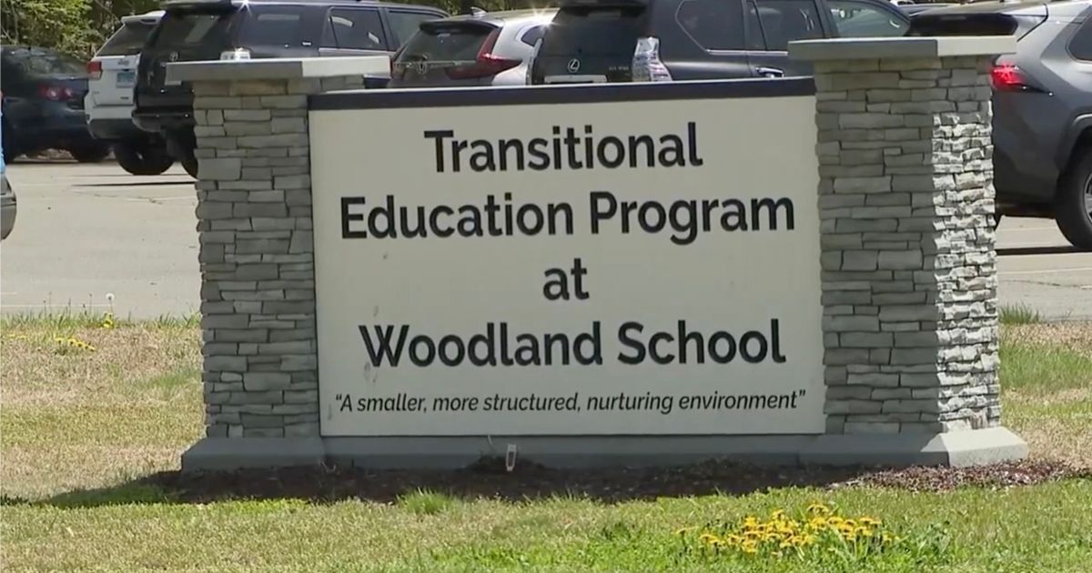 A sign that says transitional education program at woodland school