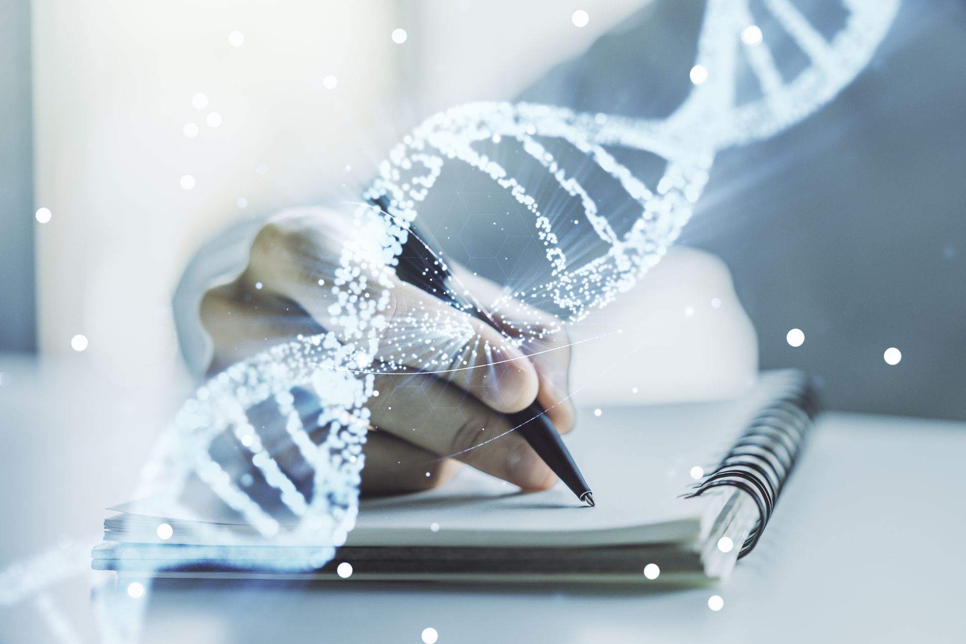 Person writing in a notebook, overlaid with a glowing DNA double helix.