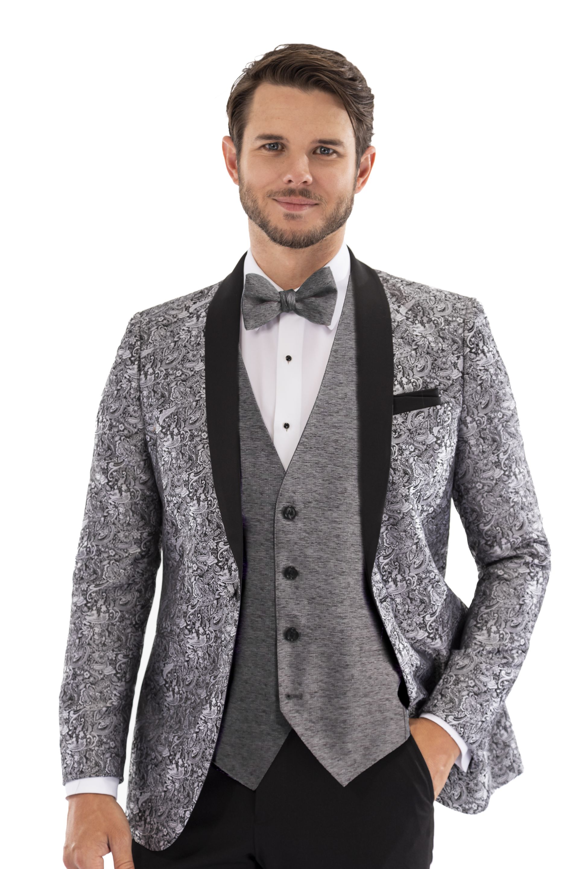 A man is wearing a tuxedo and a bow tie.