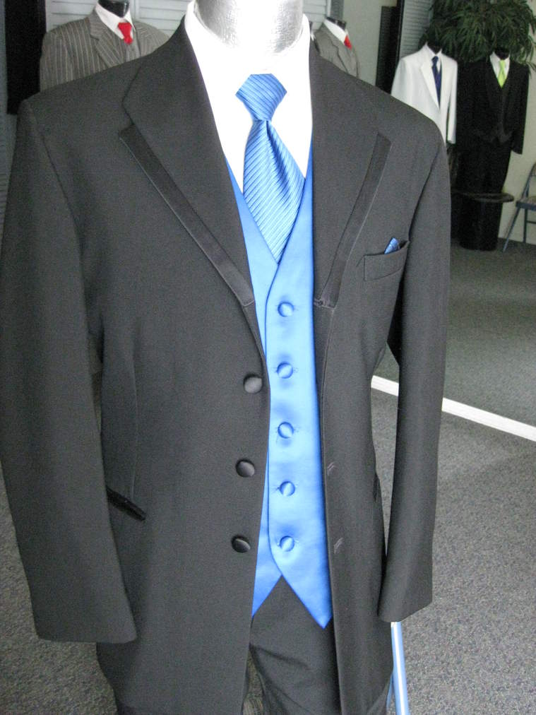 A black suit with a blue vest and tie on a mannequin