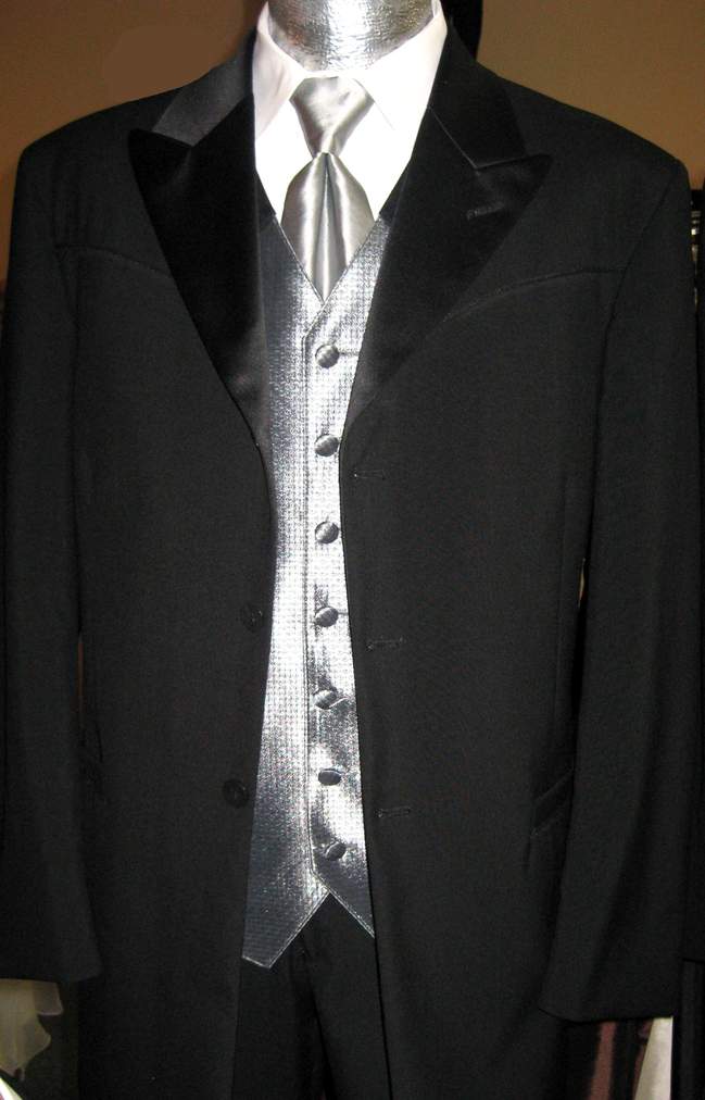 A black tuxedo with a silver vest and tie