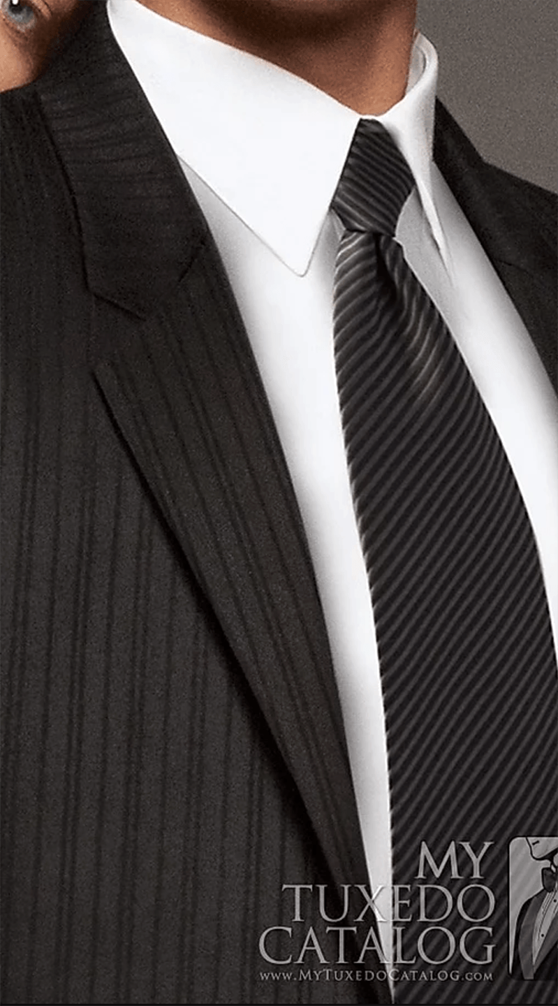A man is wearing a suit and tie from my tuxedo catalog