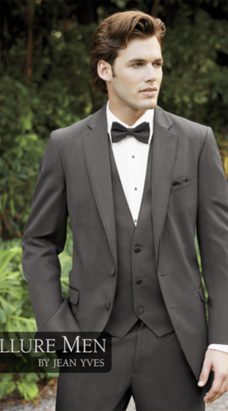 A man is wearing a tuxedo and bow tie.