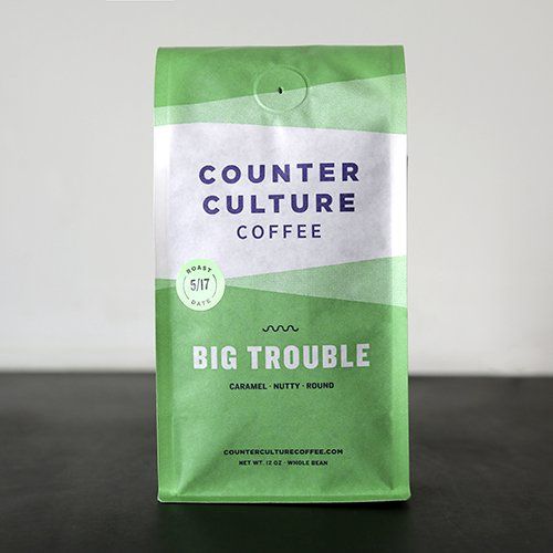 A bag of counter culture coffee is sitting on a table.