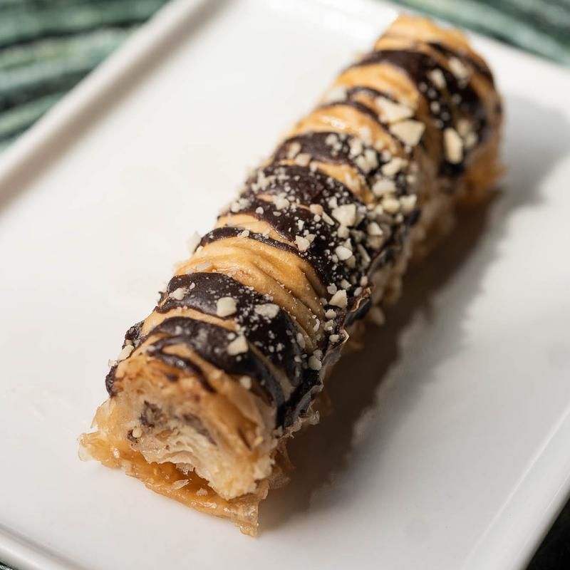 A close up of a dessert on a white plate.