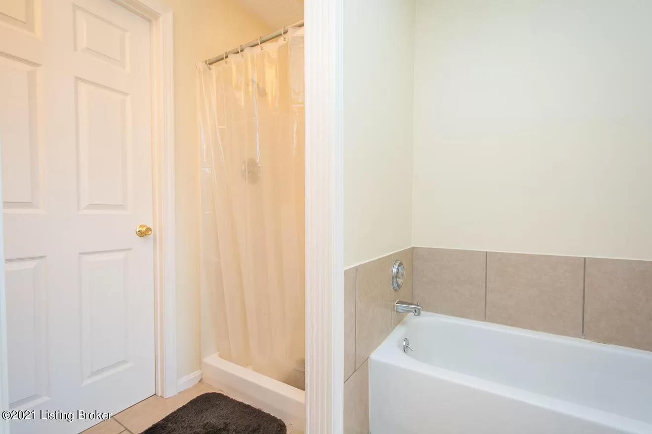 A shower stall is being built in a bathroom.