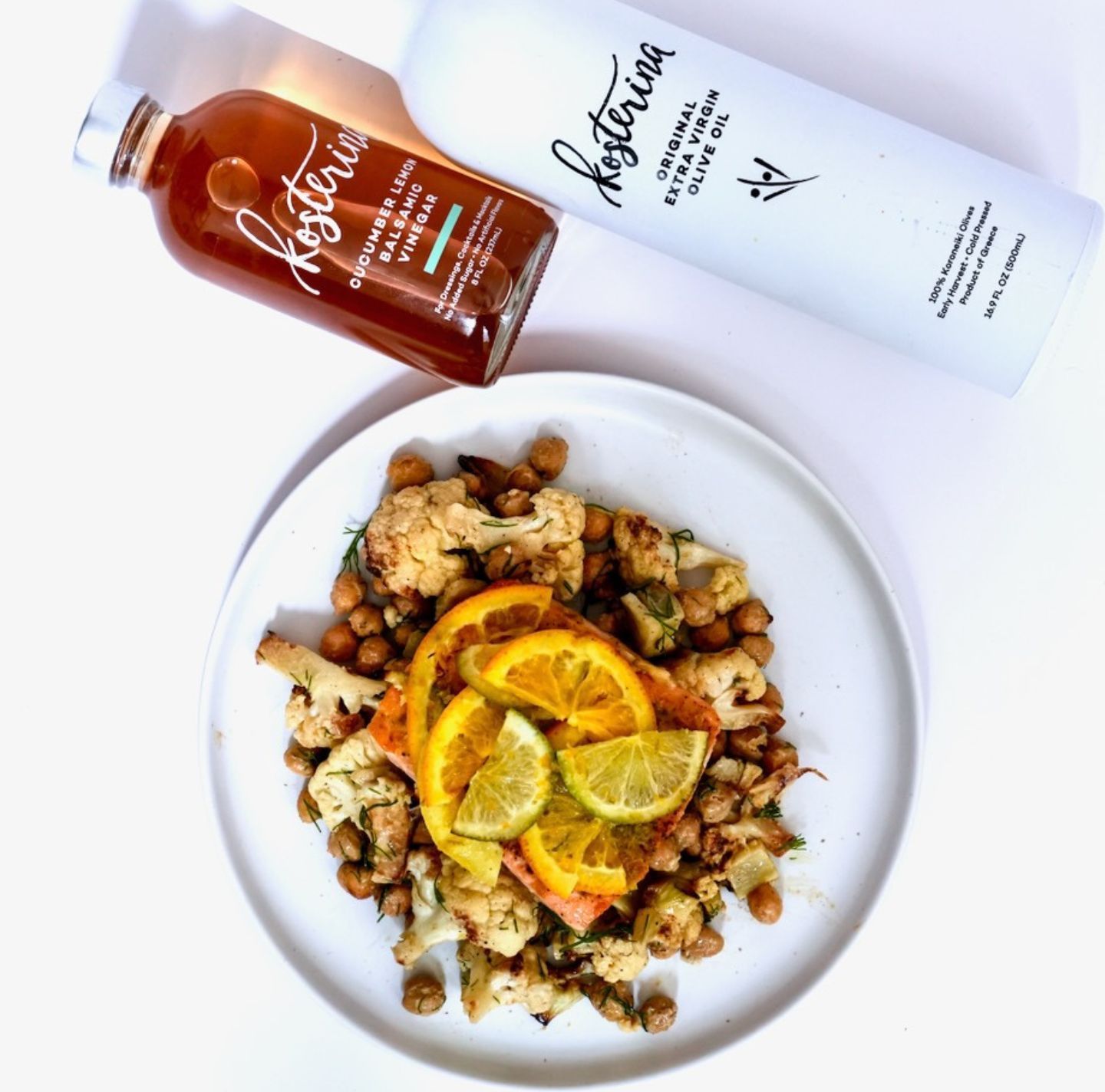A plate of food next to a bottle of mysteriosa