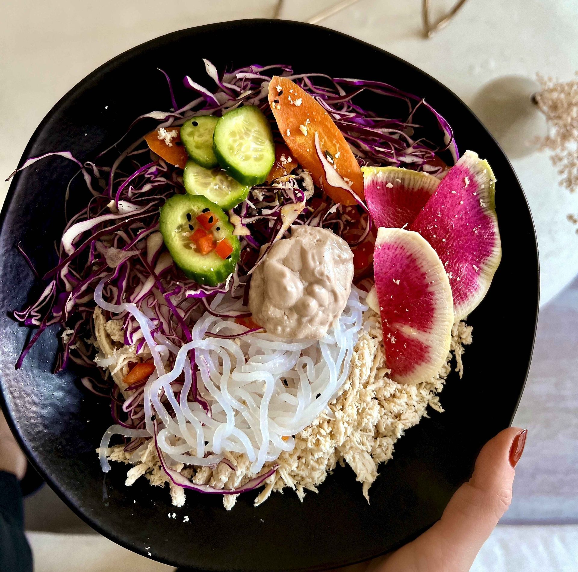 Nutrient-dense meal from The Program by Daily Dose, featuring shredded chicken, shirataki noodles, vibrant vegetables, and creamy dressing. Designed for peak performance, energy, and recovery.