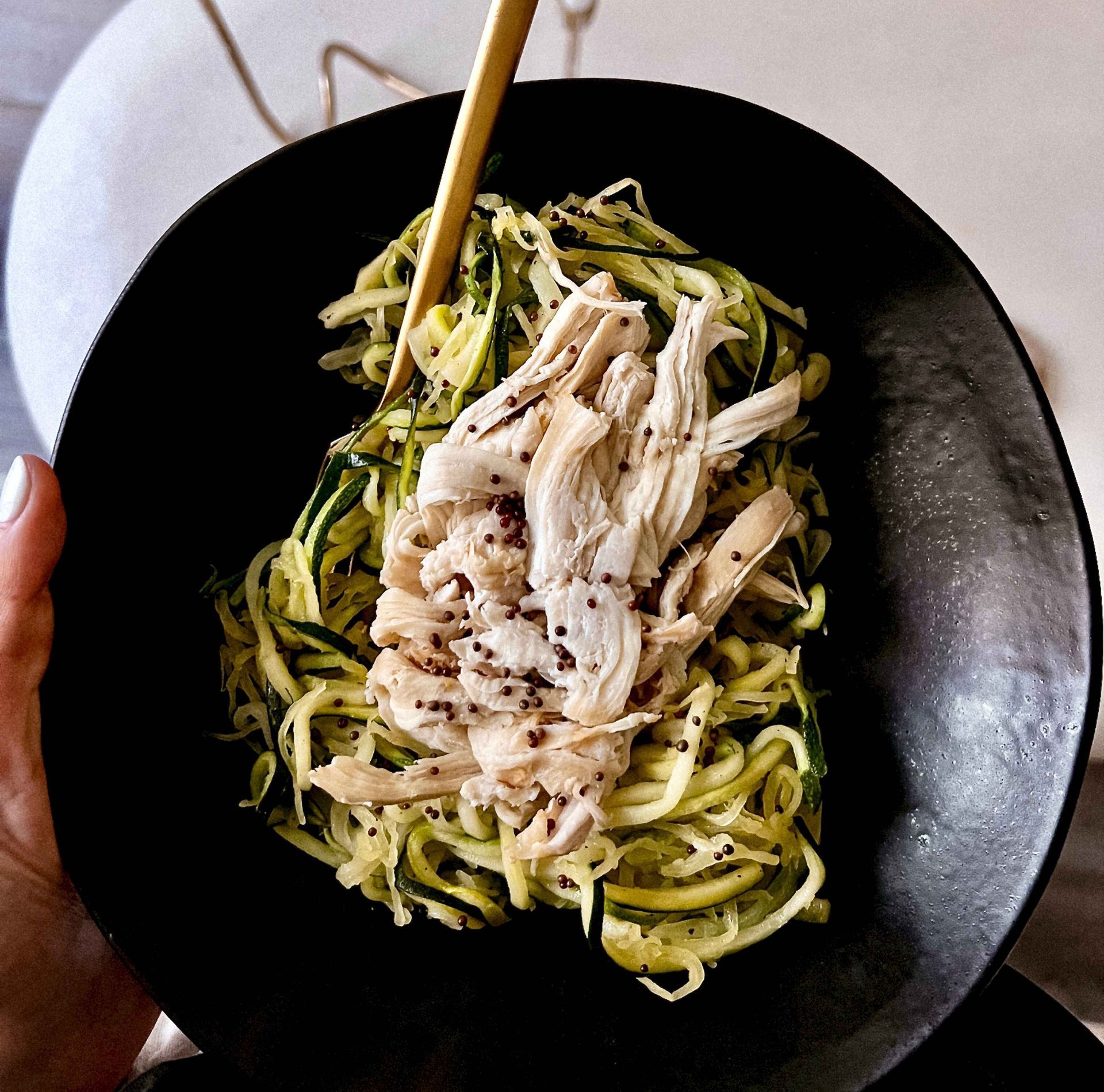 Mood + Food Meals by Dr. Uma Naidoo and Daily Dose—gut-healthy shredded chicken over zucchini noodles with mustard seeds, designed to support mental wellness, reduce inflammation, and enhance brain health through targeted nutrition.