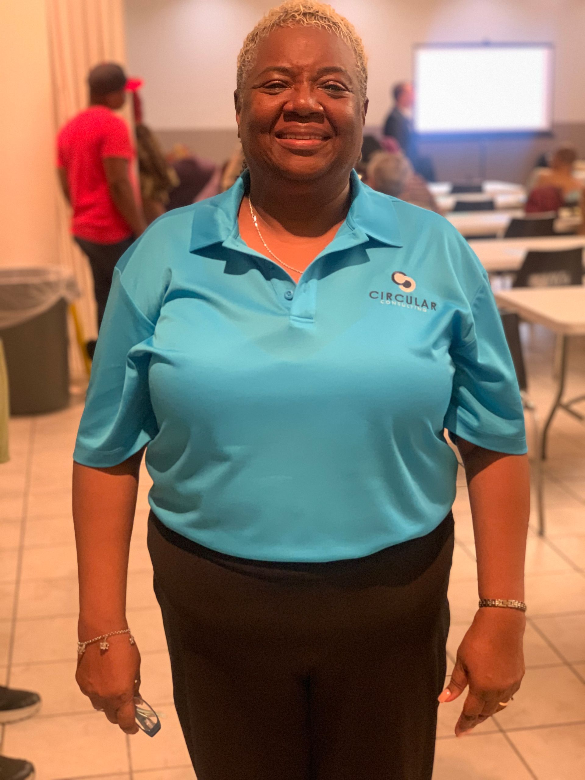 A woman wearing a blue shirt with the word canada on it