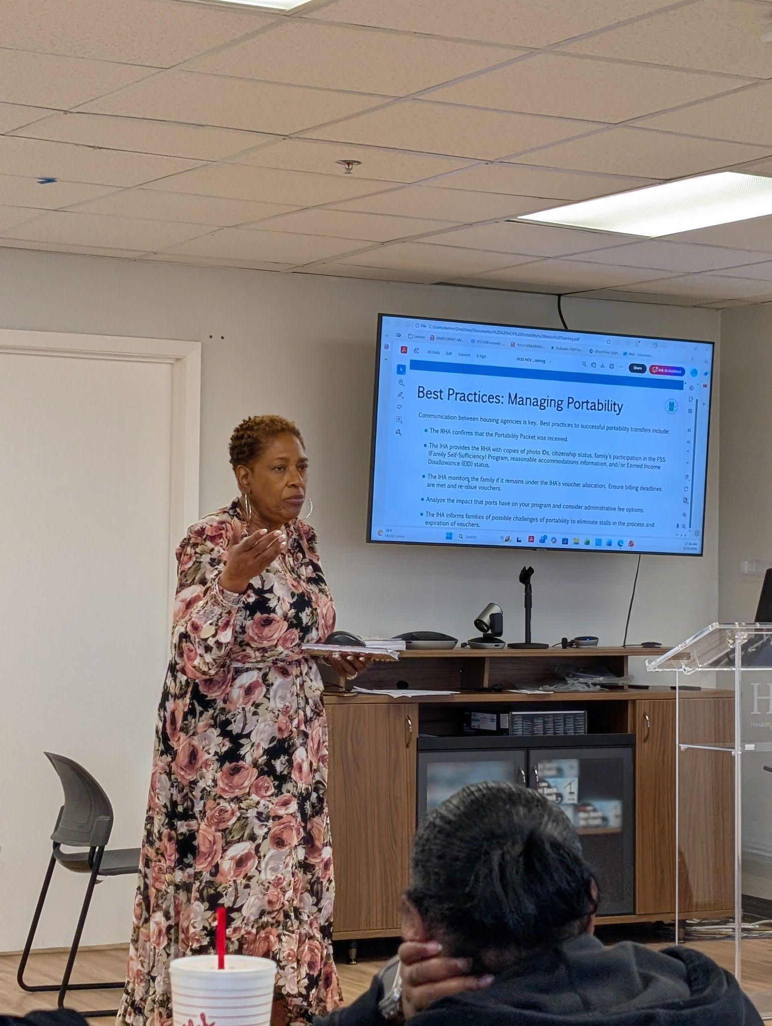 A group of people are sitting at tables in a room.