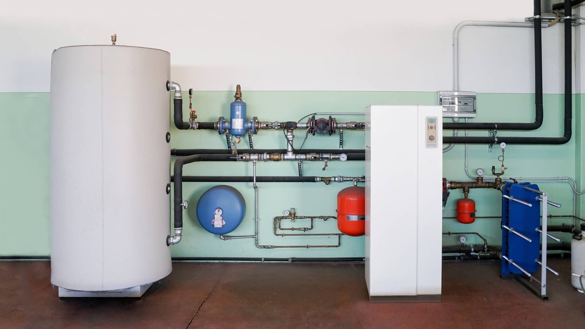 Geothermal heat pump, part of a geothermal energy heating and cooling system, in a commercial space 