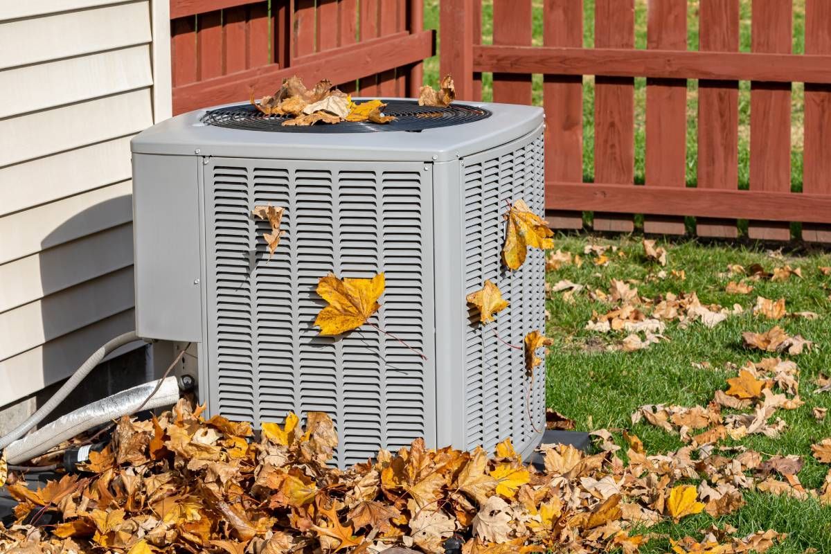 Residential HVAC Inside a Fenced Yard Surrounded by Fall Leaves near Lexington, Kentucky