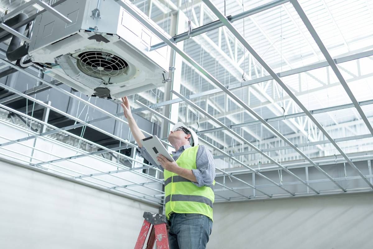 A technician maintaining a commercial HVAC system near Lexington, Kentucky (KY)