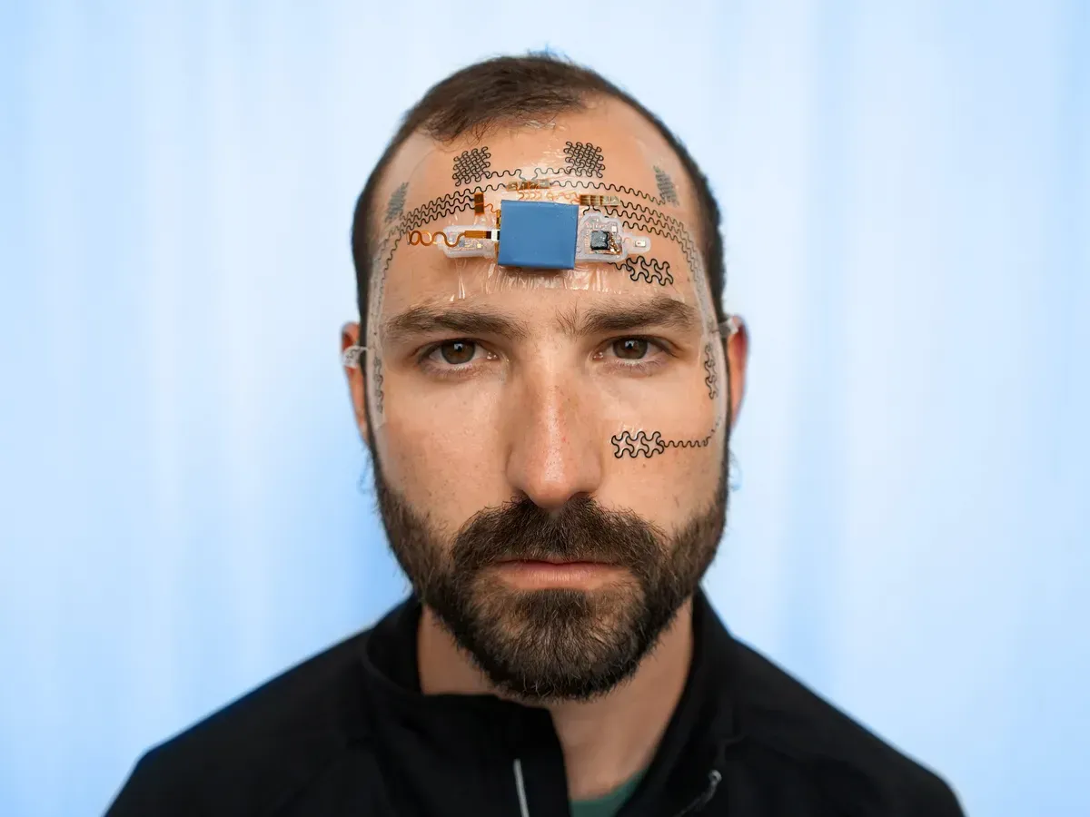 Bearded man with electronic face tattoo