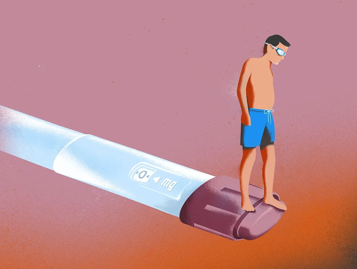 Cartoon of man in swimming trunks and goggles standing on an auto-injector for medicine