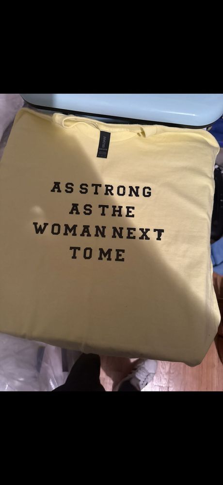 AS STRONG AS THE WOMAN NEXT TO ME