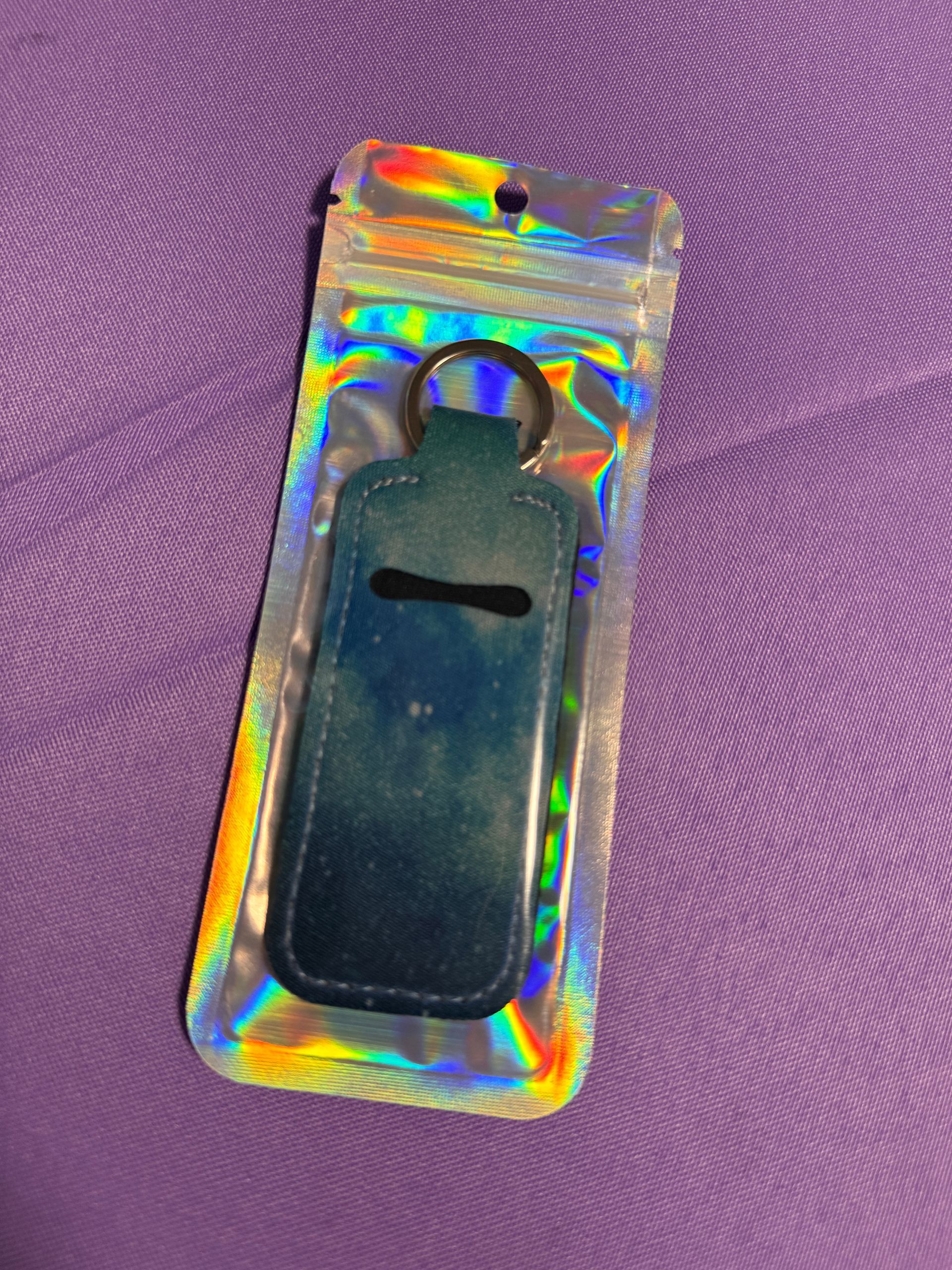 Blue Chapstick holder with two chopsticks