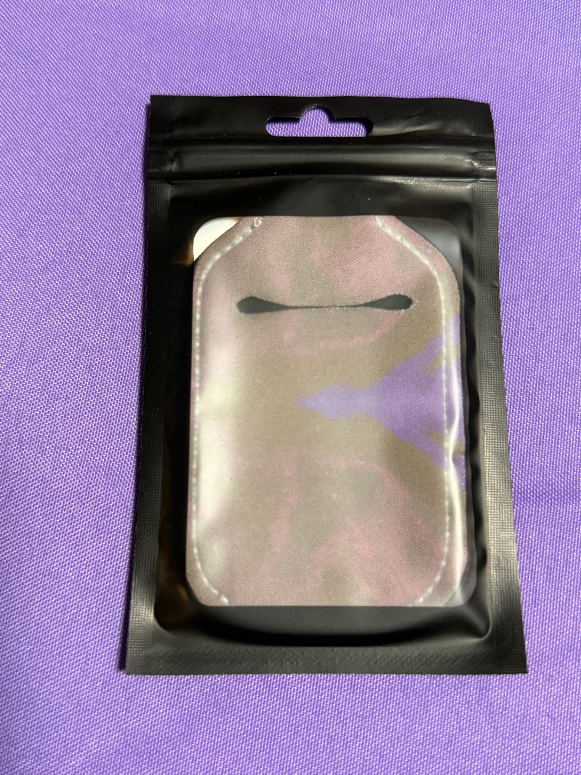 Brown hand sanitizer keychain with a bottle of sanitizer