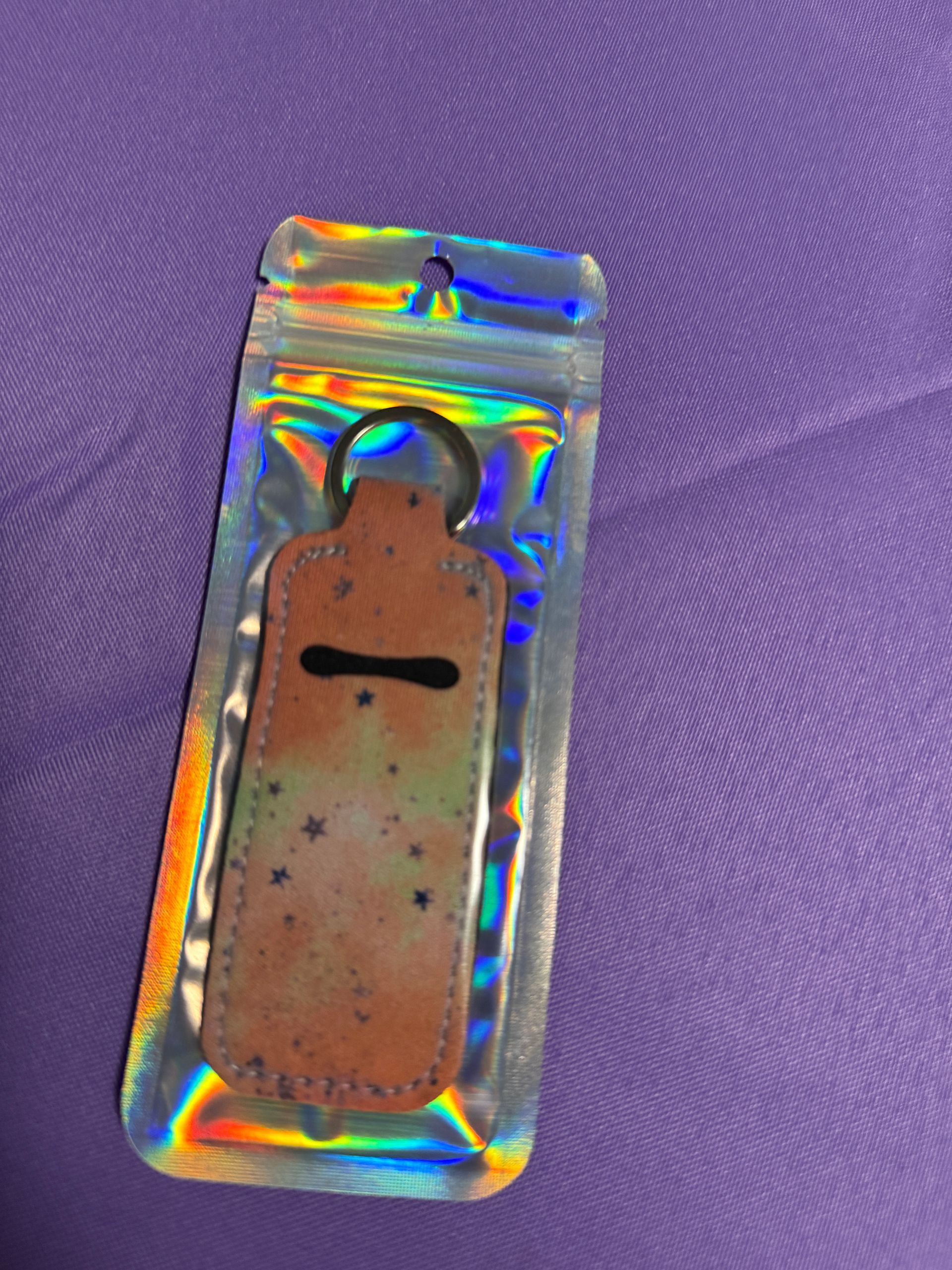 Orange and a touch of yellow with stars Chapstick holder with two chopsticks