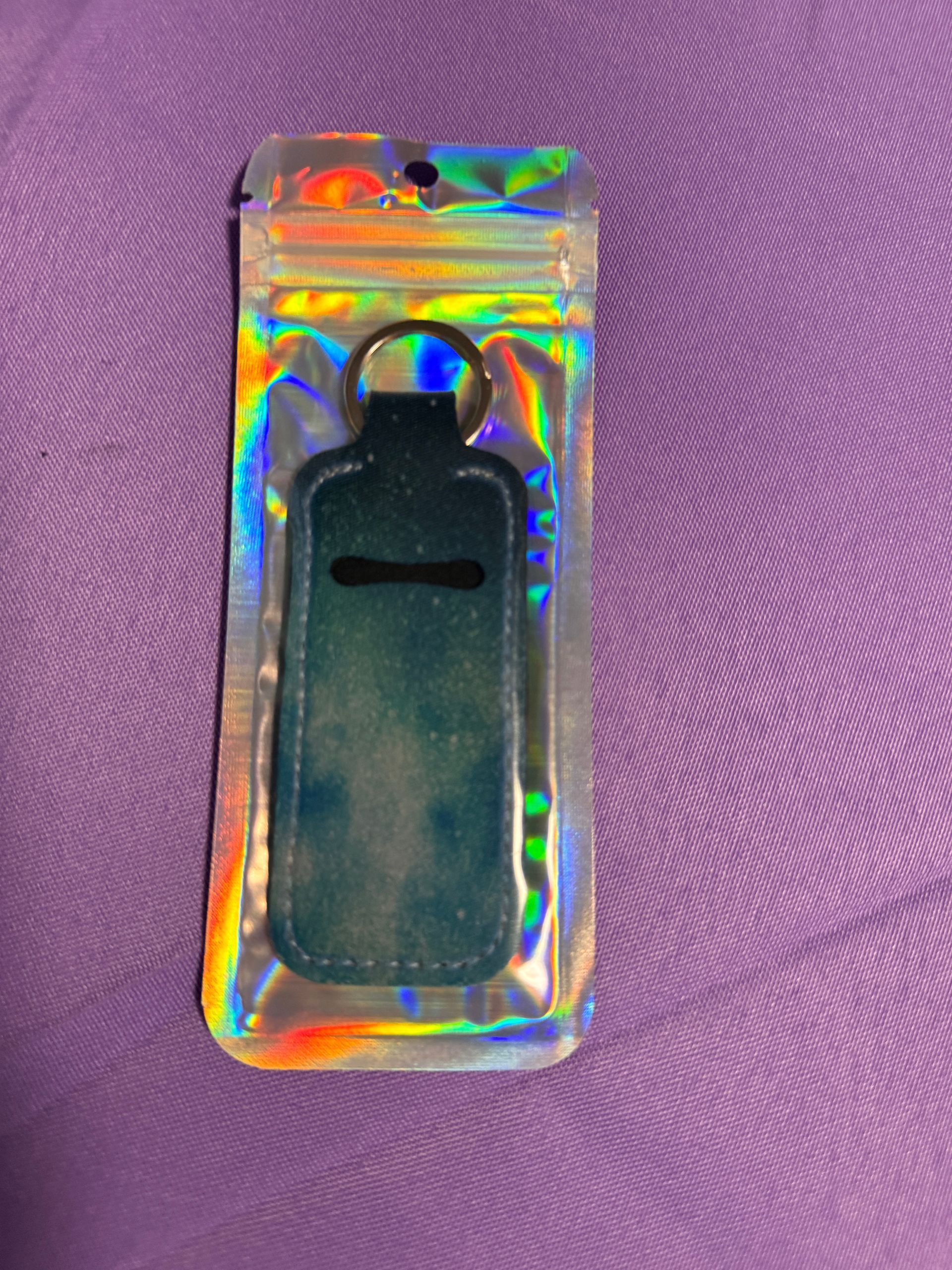 Bluish Chapstick holder with two chopsticks