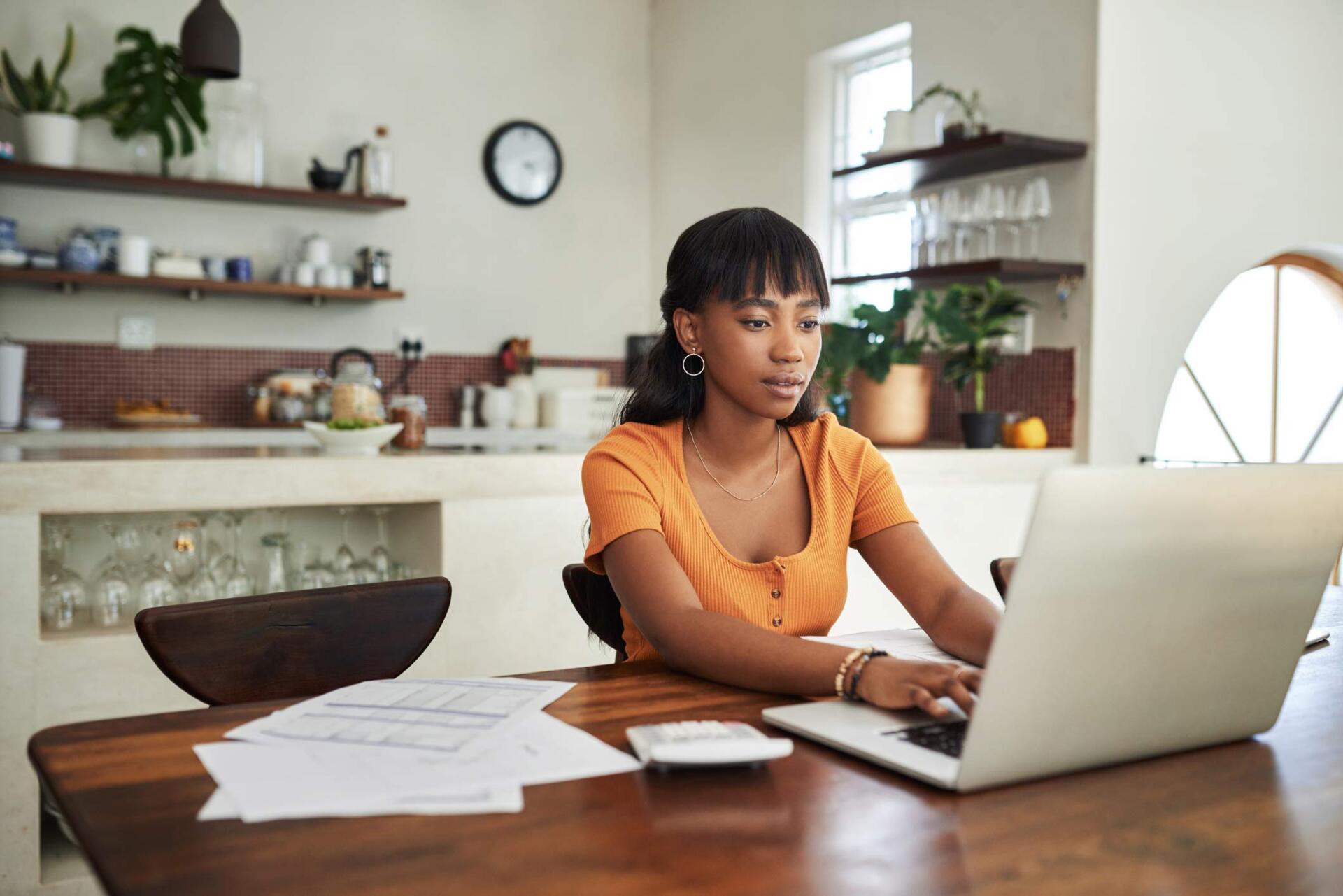 Woman Using A Laptop — Fort Walton Beach, FL — Sullivan Insurance Of NW FL, Inc.