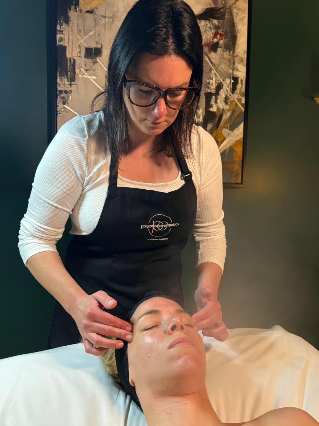 Hairdresser cutting hair with scissors and a comb in a salon.