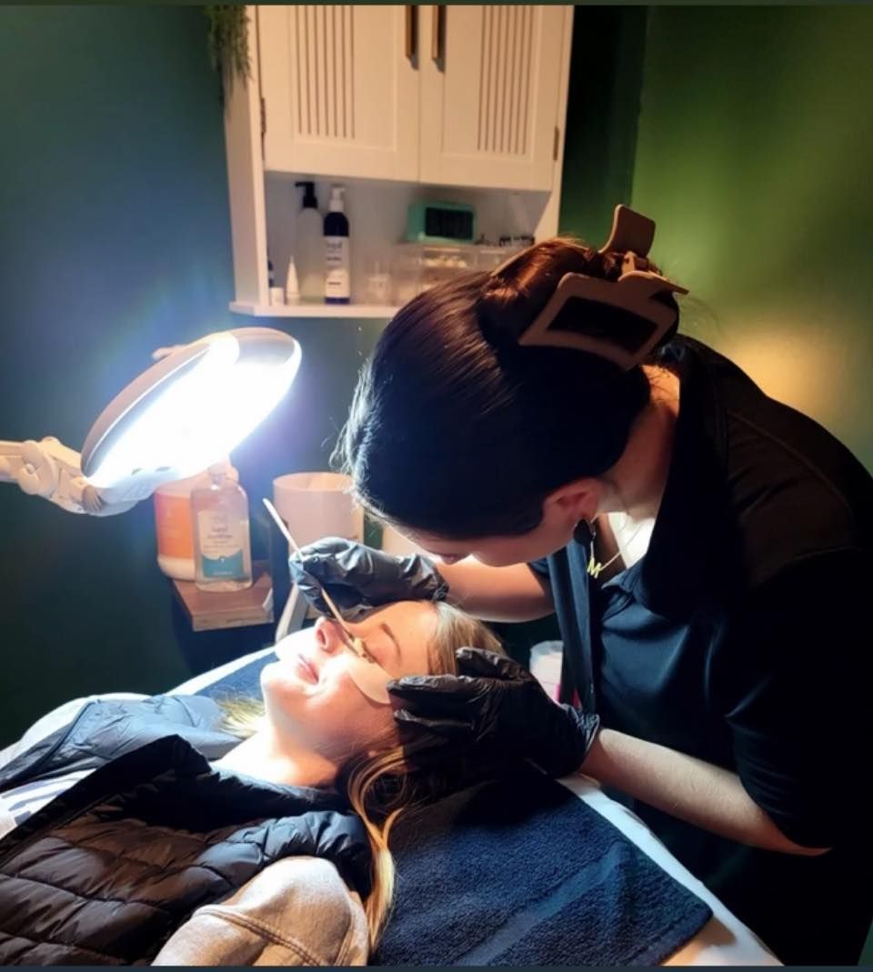 Hair being styled with a round brush and hairdryer.