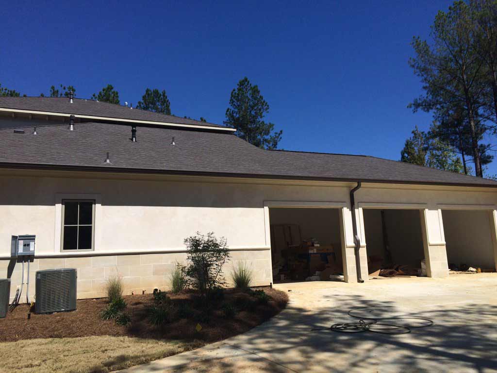 High-flow Gutters — House With Opened Garage Doors in Madison, MS