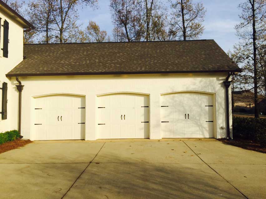 Painted Aluminum Gutters — White House With 3 Garage Doors in Madison, MS