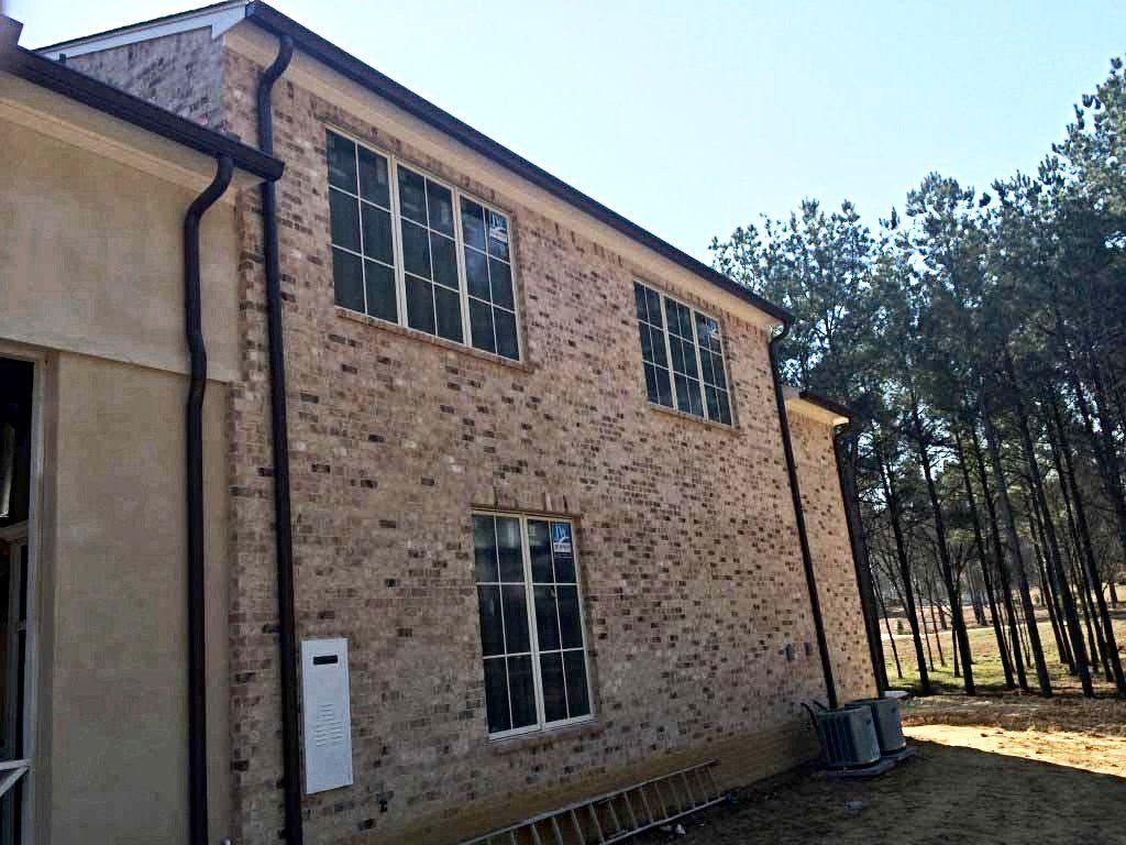 Copper Downspout — Two Story Brick House in Madison, MS