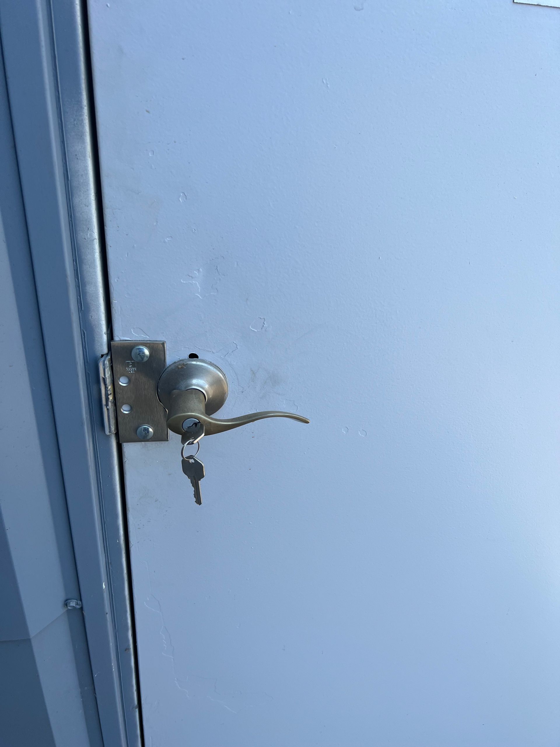 A close up of a door with a key in it.