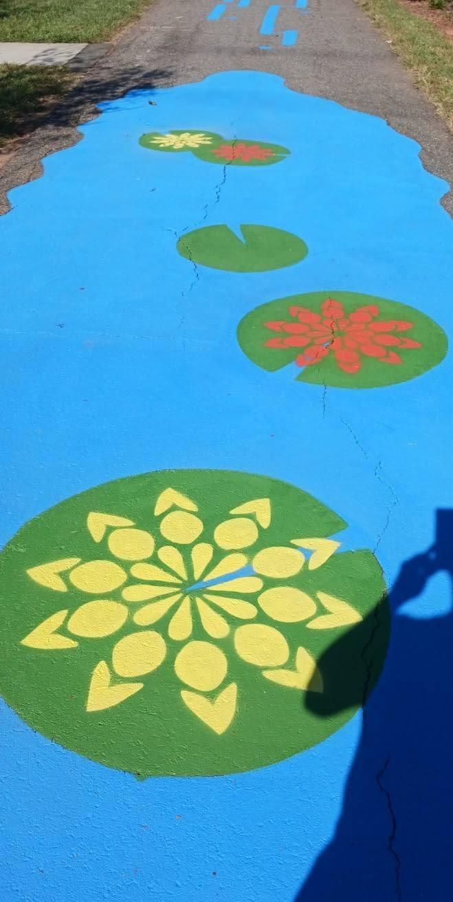 Blue painted path with lily pads.