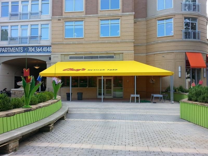 Entrance to a Mexican restaurant under a yellow awning.