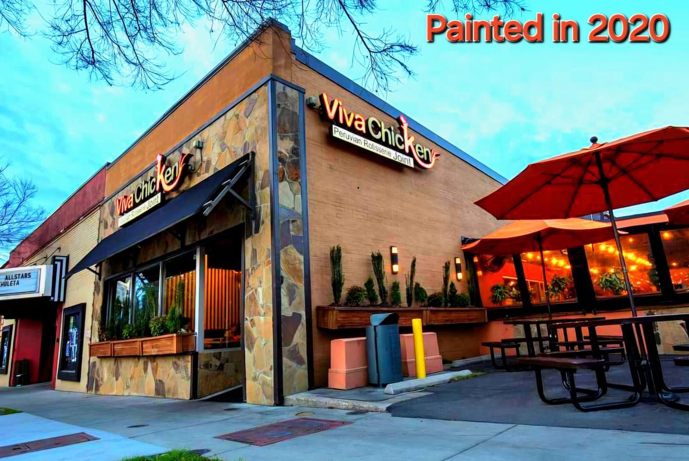 Viva Chicken restaurant, exterior view. Building with stone facade.