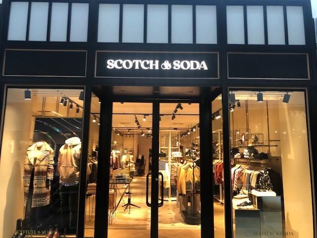 Scotch & Soda store exterior with glass windows and a black frame.