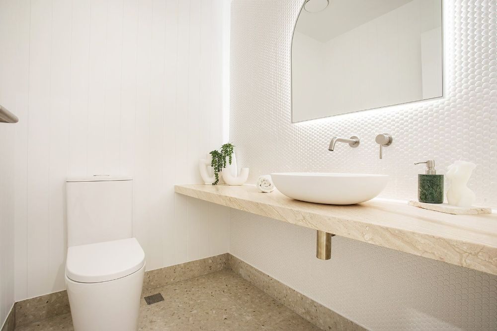 Bathroom With a Toilet , Sink and Mirror — Beith Building & Developments Pty Ltd In Burleigh Heads, QLD