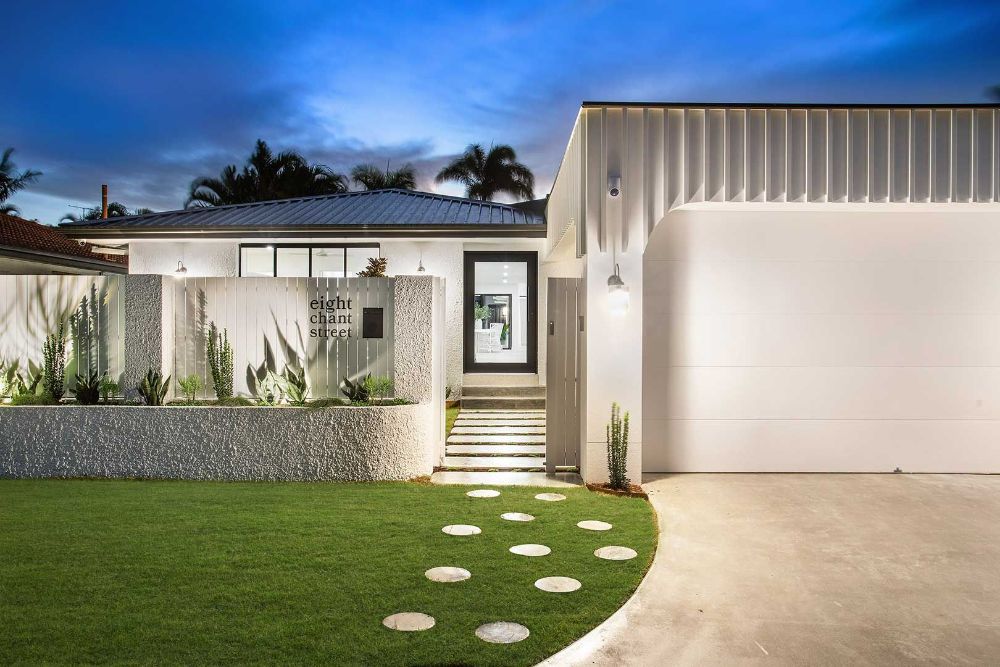 Modern White House With a Large Garage and a Walkway Leading to It — Beith Building & Developments Pty Ltd In Burleigh Heads, QLD