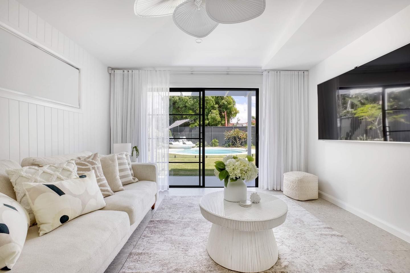 Living Room with A Couch, Coffee Table, and Television — Beith Building & Developments Pty Ltd In Hope Island, QLD