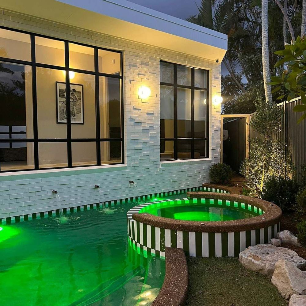 Swimming Pool With Green Lights in Front of a House — Beith Building & Developments Pty Ltd In Broadbeach, QLD