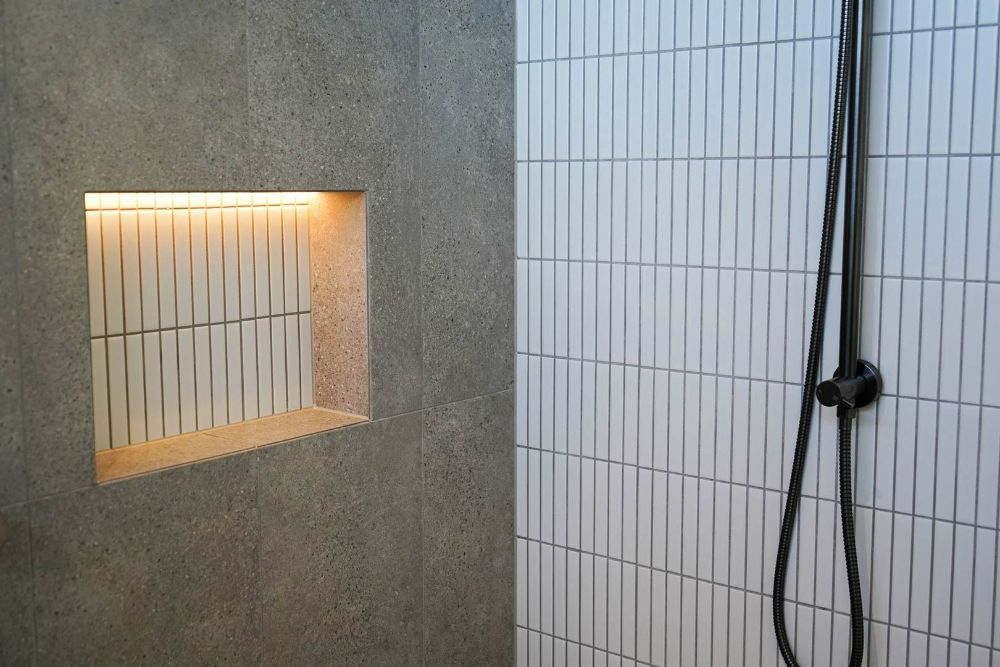 Bathroom with White Tiles and A Shower Head — Beith Building & Developments Pty Ltd In Burleigh Heads, QLD