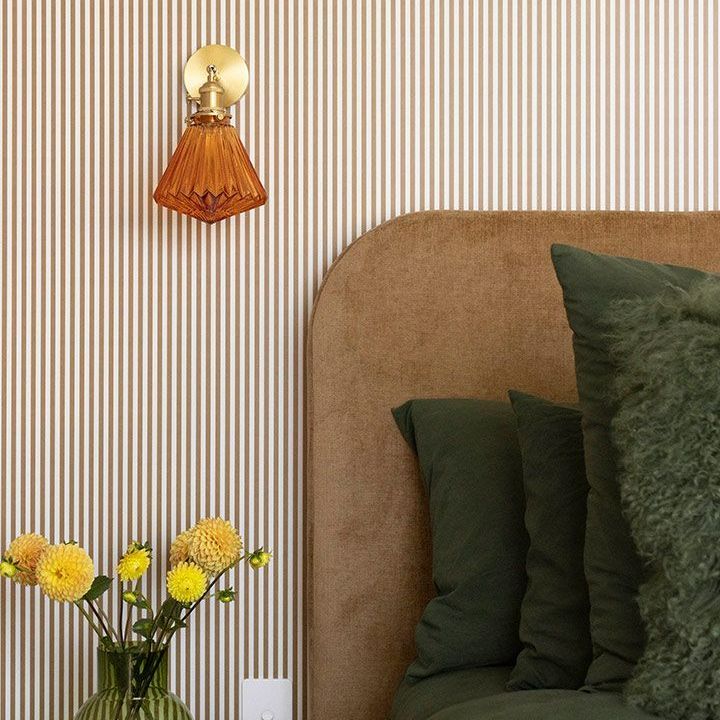Bedroom With Striped Wallpaper and a Lamp on the Wall — Beith Building & Developments Pty Ltd In Burleigh Heads, QLD