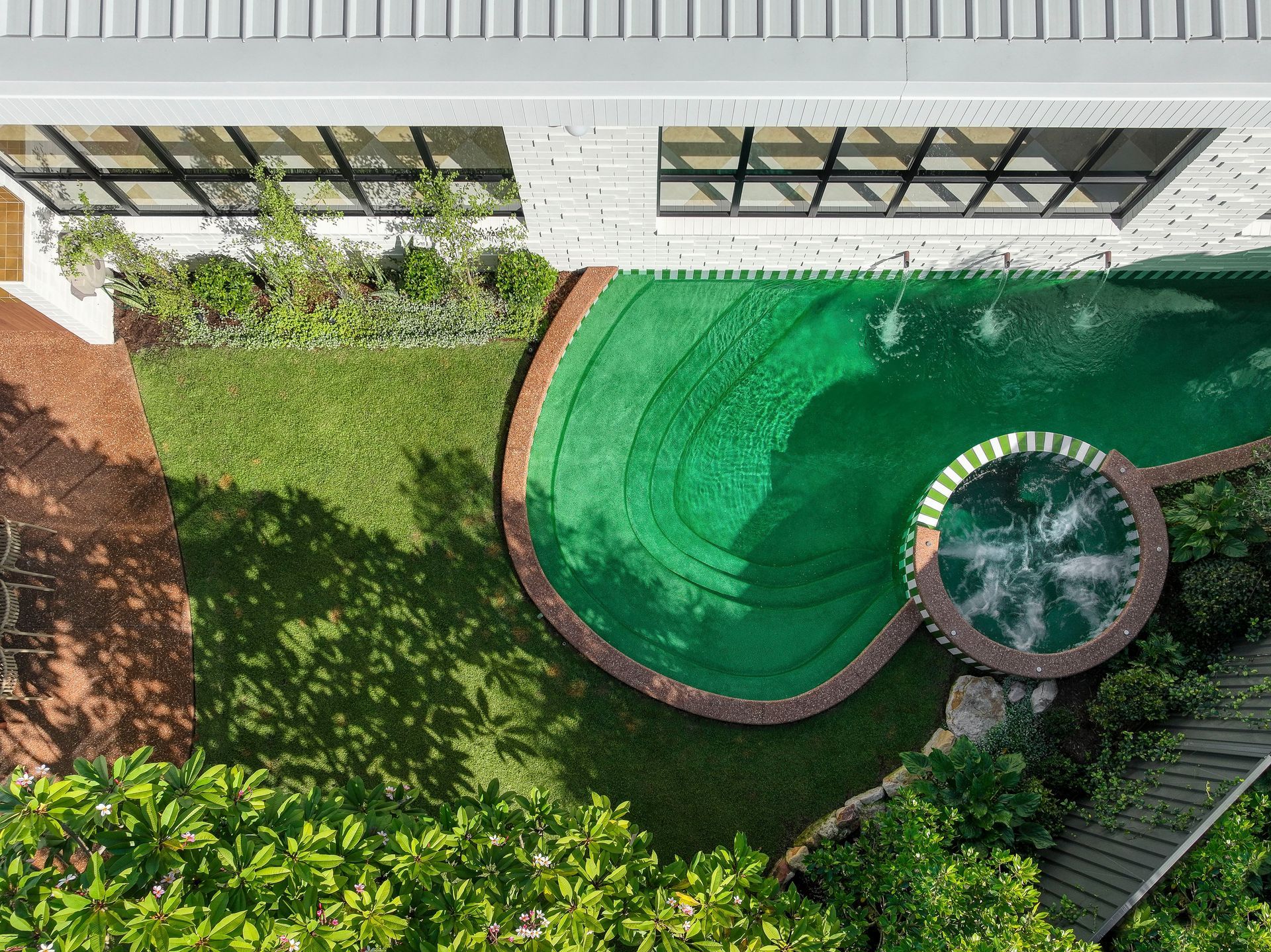 Aerial View of a House With a Large Swimming Pool in the Backyard — Beith Building & Developments Pty Ltd In Burleigh Heads, QLD