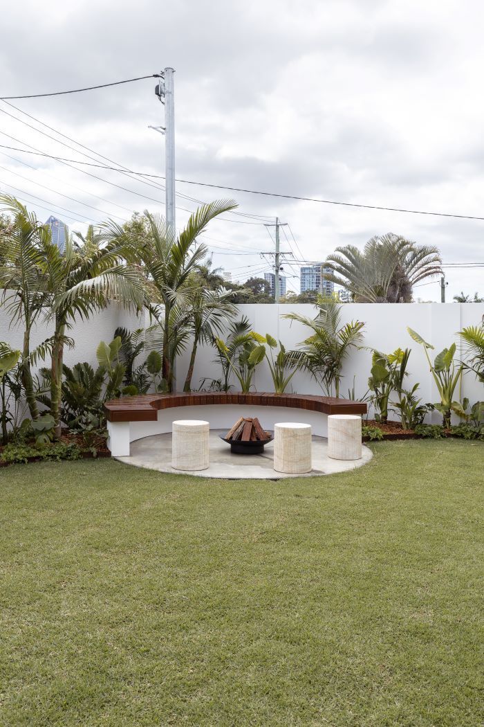 A Fire Pit in the Middle of the Grass in the Backyard — Beith Building & Developments Pty Ltd in Burleigh Heads, Qld