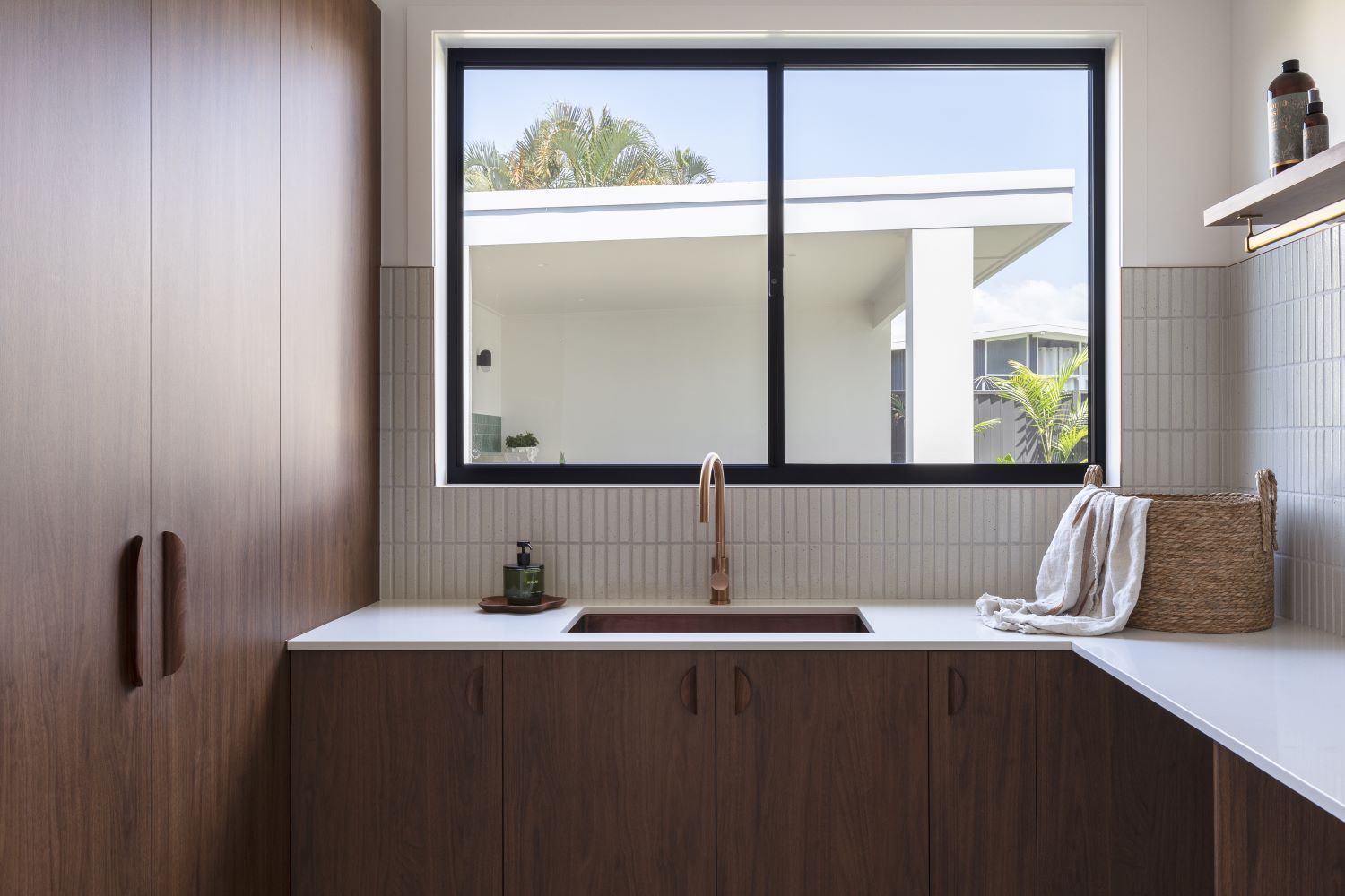A Kitchen With a Sink , Cabinets , and a Window — Beith Building & Developments Pty Ltd In Burleigh Heads, QLD