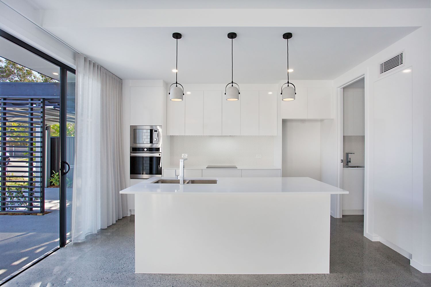 There is a large island in the middle of the kitchen.