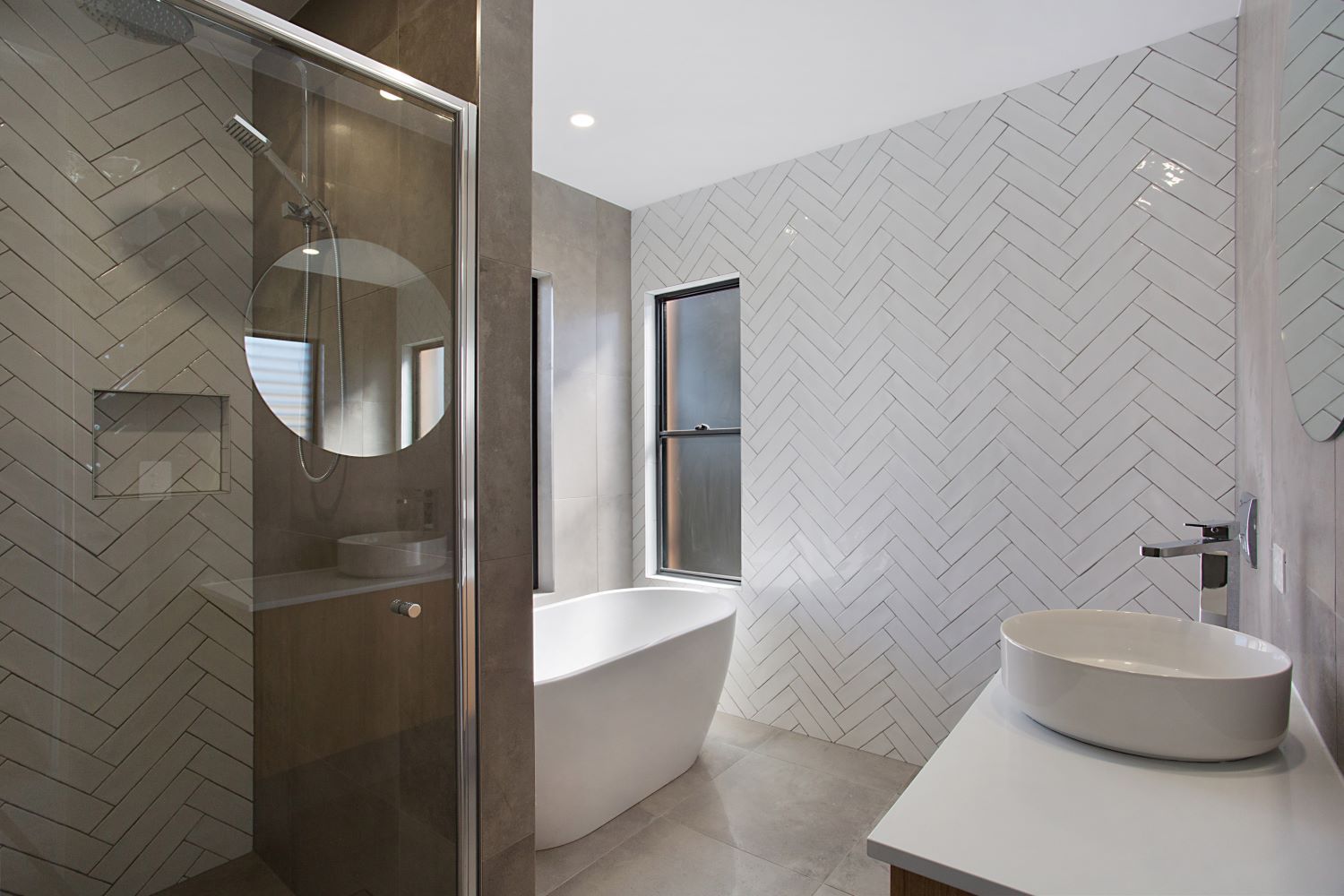 A modern house with two cars parked in front of it