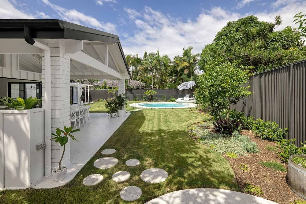 There is a Swimming Pool in the Backyard of a House — Beith Building & Developments Pty Ltd In Burleigh Heads, QLD